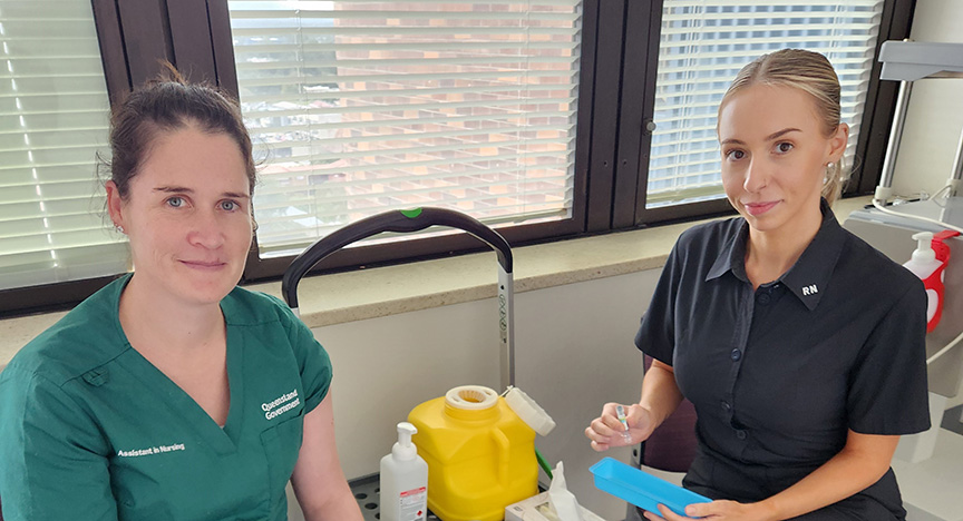 Katelyn Verrall (left) gets ready for her flu jab delivered by Infection Prevention Clinical Nurse Georgia Naden (right)